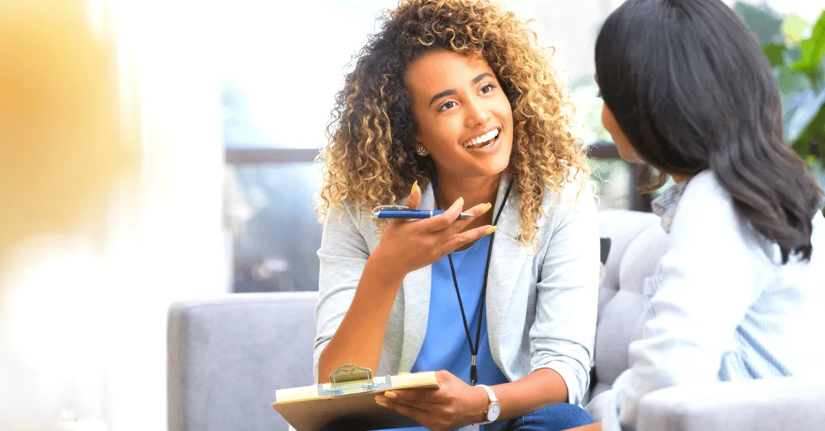 A therapist sits across from a client