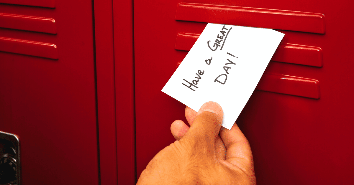 Someone is doing a random act of kindness by putting a nice note in someone's locker